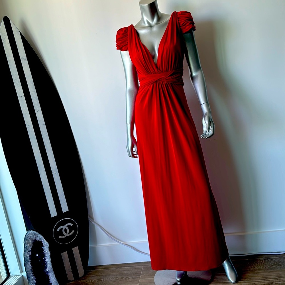 Red gathered cap shoulders deep plunge back with zipper.